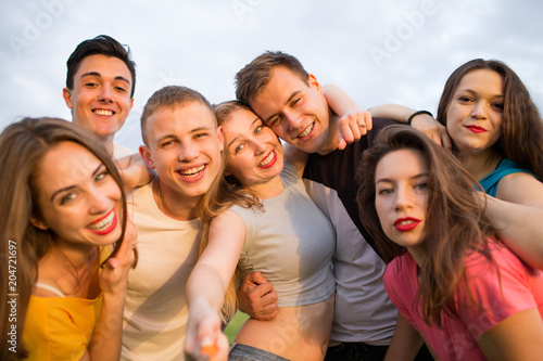 Group of happy young people laughing