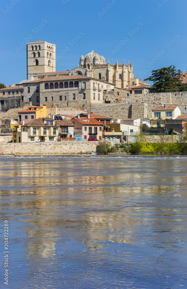 Historic cathedral with reflection in the Duero river in Zamora, Spain