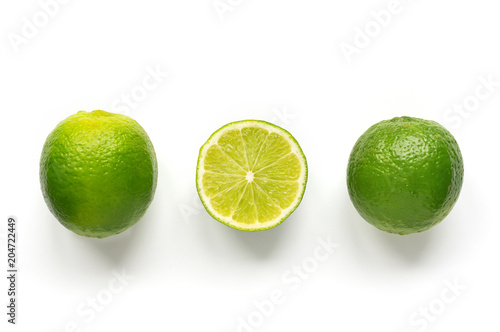 Isolated limes. Row ripe citrus on white background. 