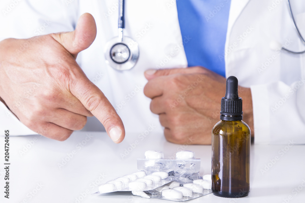 doctor with medication and pills at the hospital table doctor with medication and pills at the hospital table