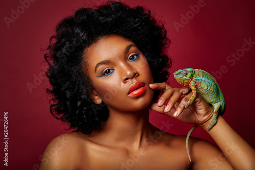 beautiful woman holding chameleon