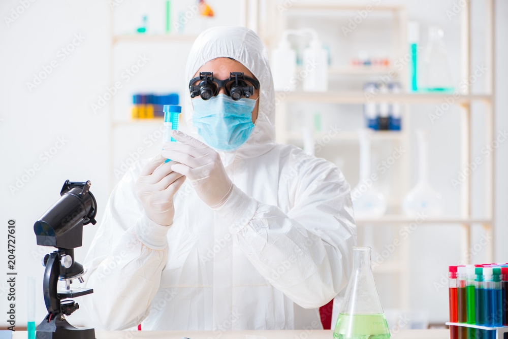 Young chemical scientist working in lab Young chemical scientist working in lab