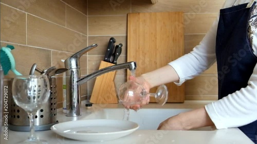 Woman Washing Dishes photo