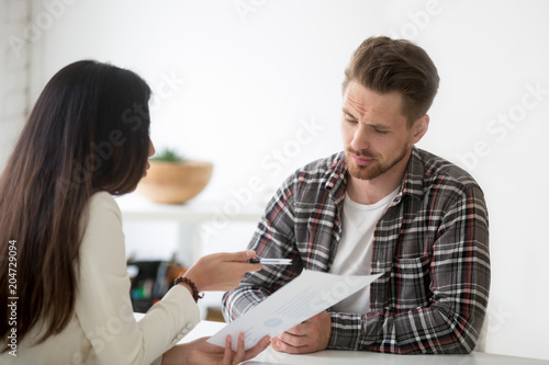 Tablou pe pânză Unconvinced skeptical client looking doubtful about rejecting deal listening to