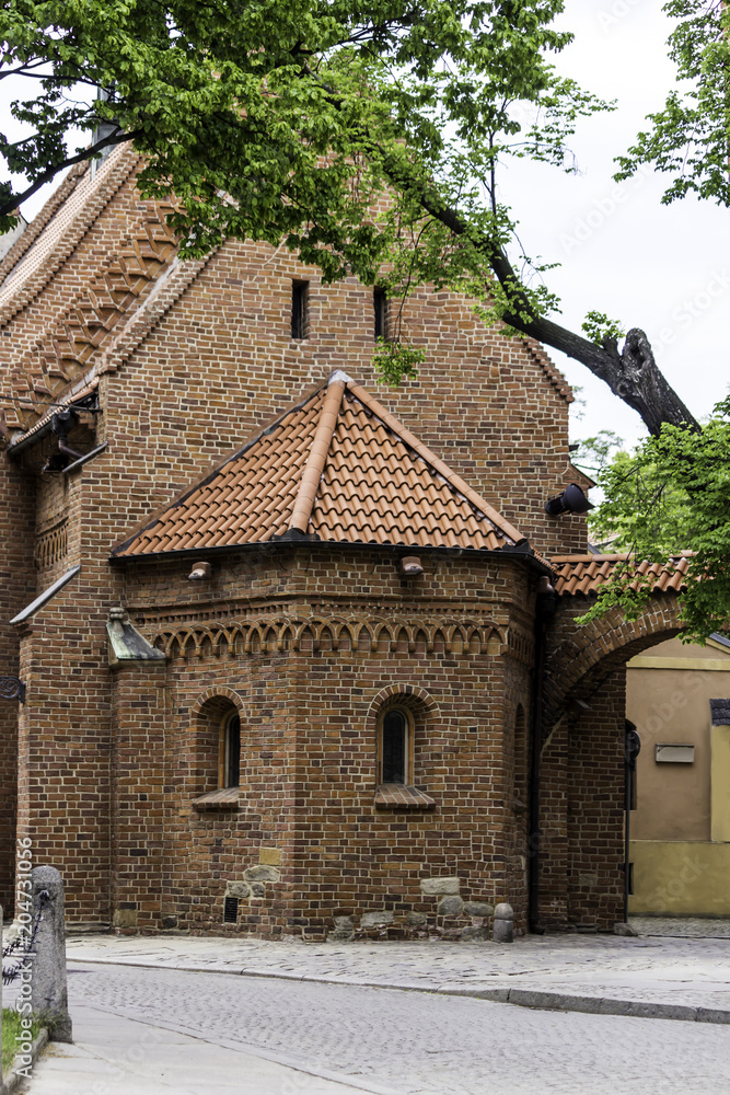 Old brick church in Romanesque style. Apse on the east side and Dumpling gate.Tile, brick decoration. St.Giles church in Wroclaw , Poland .