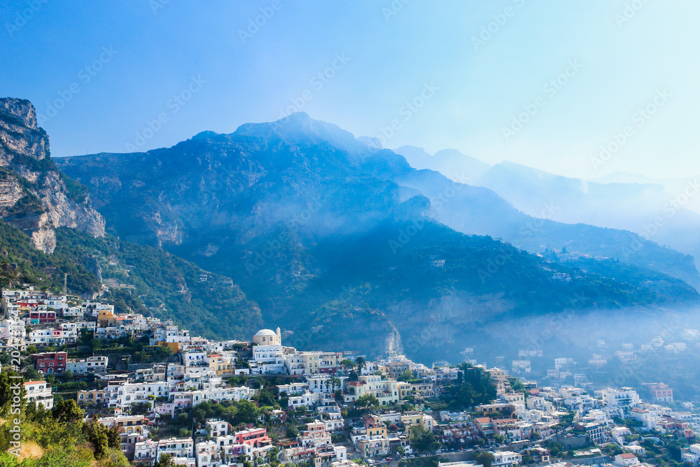 View of Positano town at Amalfi coastline. Colorful houses along the sea coast, Italy