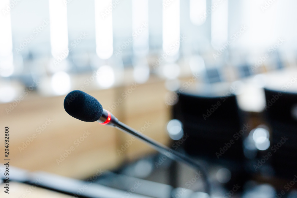 Microphone over the blurred business forum Meeting or Conference Training Learning Coaching Room Concept, Blurred background Microphone over the blurred business forum Meeting or Conference Training Learning Coaching Room Concept, Blurred background