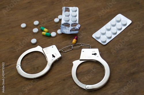 drugs and pills, handcuffs

