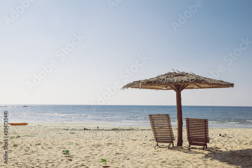 Fototapeta Naklejka Na Ścianę i Meble -  Chair, umbrella, beach seaside that evening air.