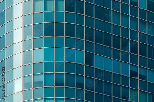 close-up of the facade of a modern multi-storey high-rise building of blue glass