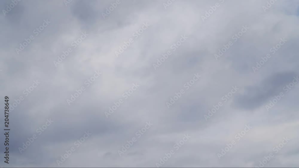 Beautiful white clouds soar across the screen in time lapse fashion over a deep blue background. Beautiful white clouds soar across the screen in time lapse fashion over a deep blue background.