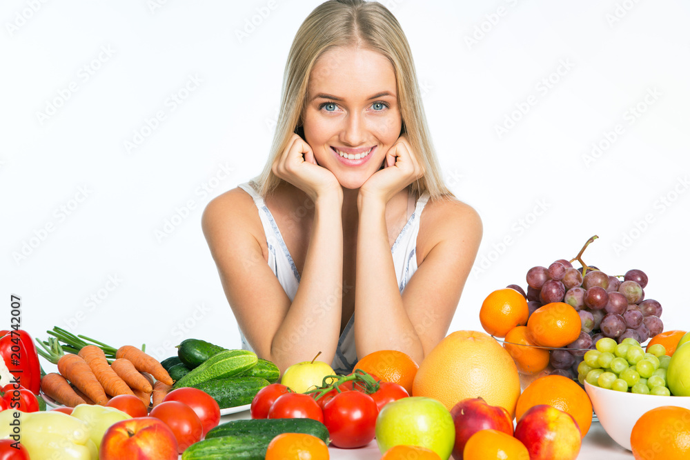 Young woman with fresh fruits and vegetables Young woman with fresh fruits and vegetables