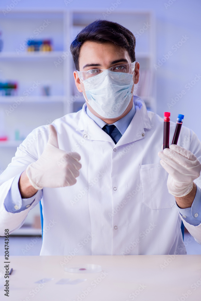 Lab assistant testing blood samples in hospital