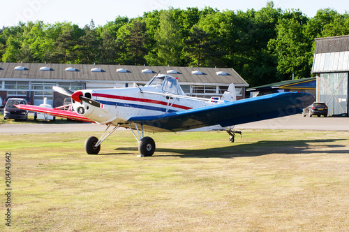 sport plane on grass field