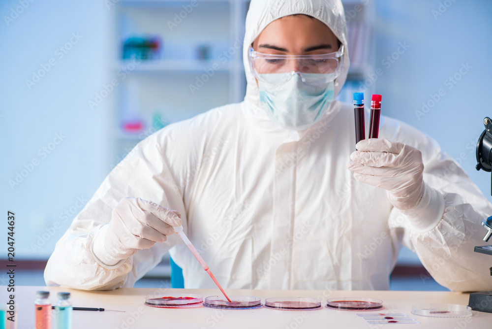Lab assistant testing blood samples in hospital Lab assistant testing blood samples in hospital