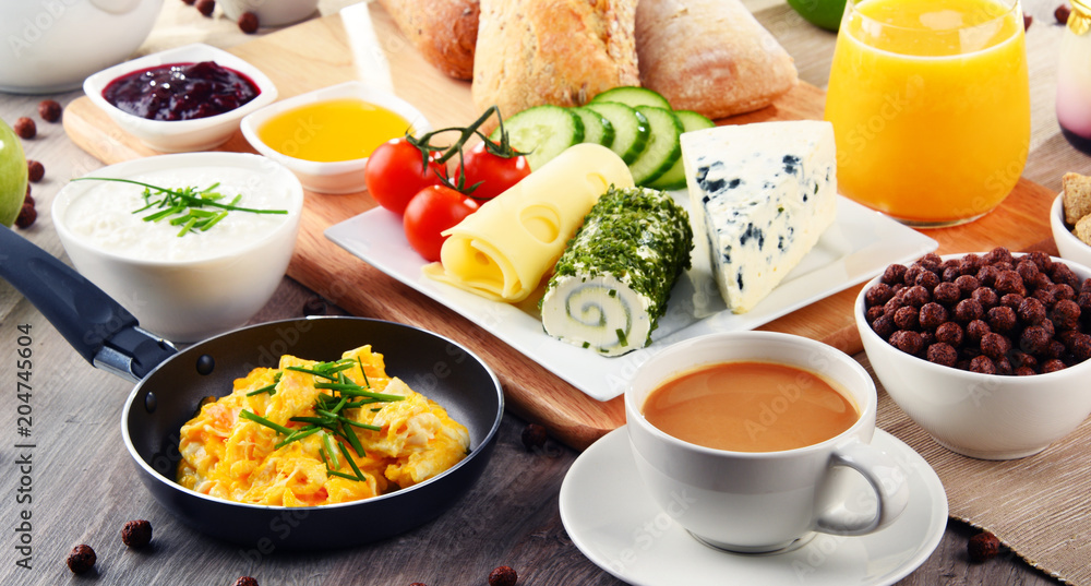 Breakfast served with coffee, cheese, cereals and scrambled eggs