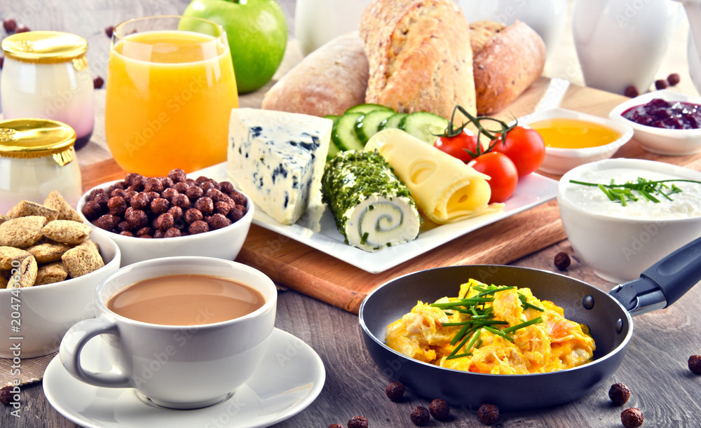 Breakfast served with coffee, cheese, cereals and scrambled eggs Breakfast served with coffee, cheese, cereals and scrambled eggs