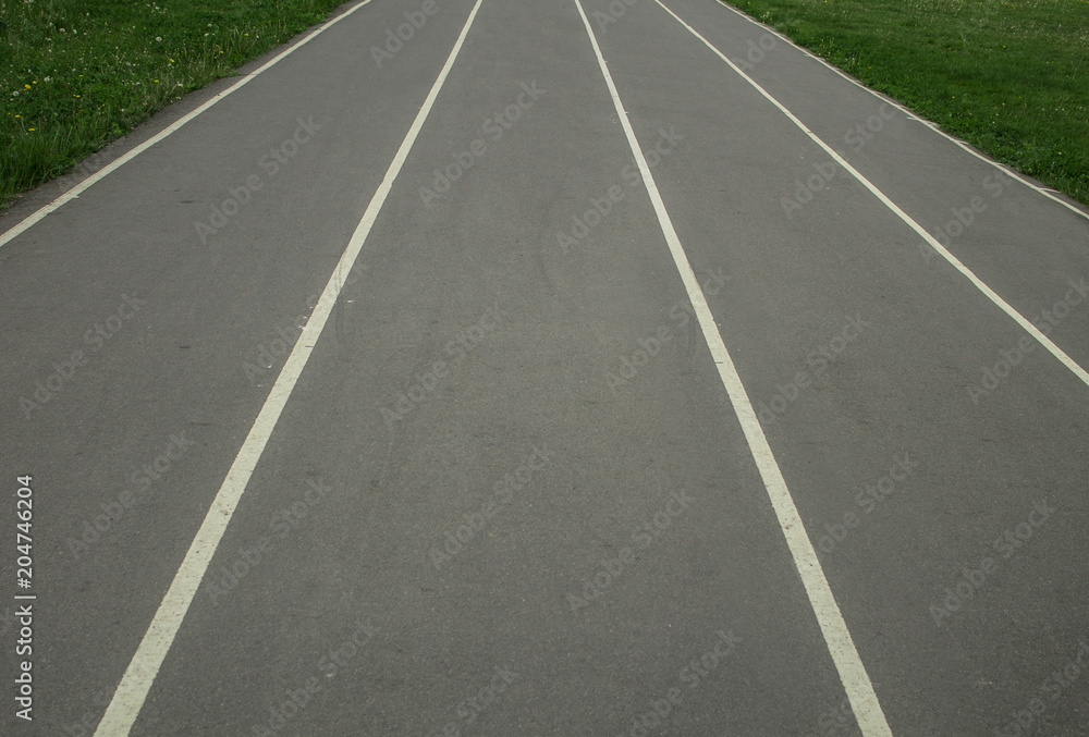 road in a sports stadium, vertical lines