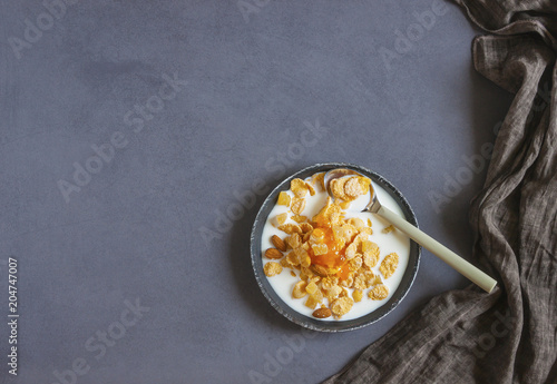 Eco healthy food background. Corn flakes with milk . Top view image