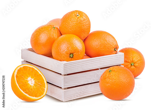 Juicy oranges  in a box isolated on white background with clipping path
