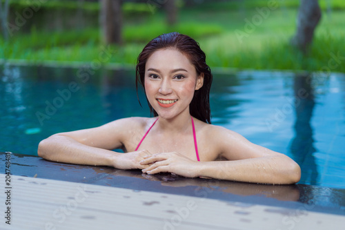 happy woman in swimming pool