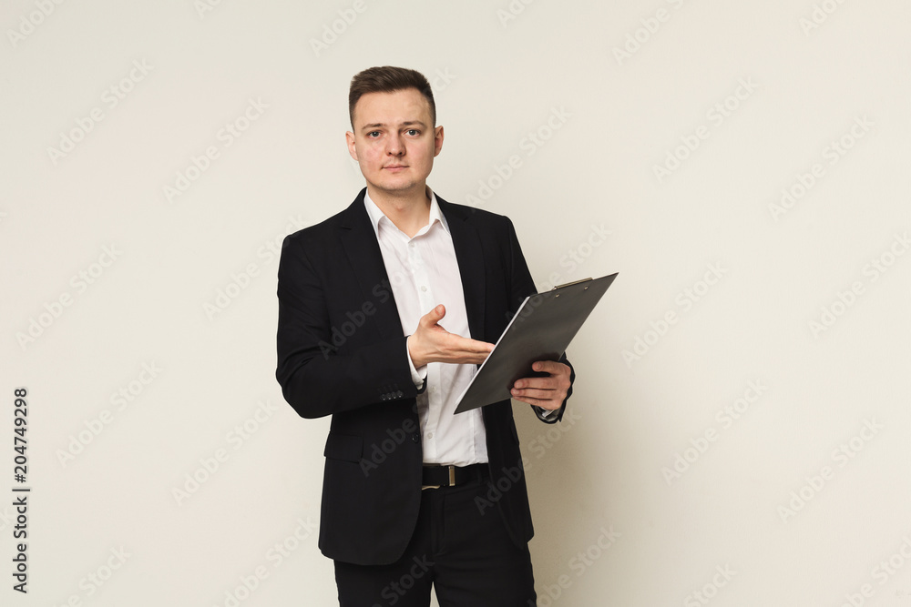 Serious man with notepad on white background Serious man with notepad on white background
