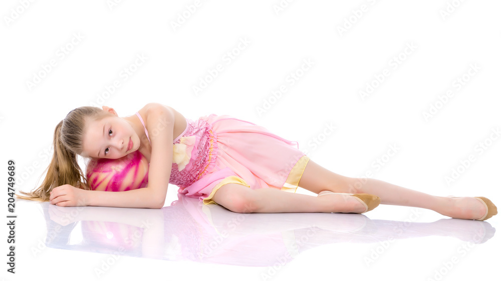 Girl gymnast performs exercises with the ball. Girl gymnast performs exercises with the ball.