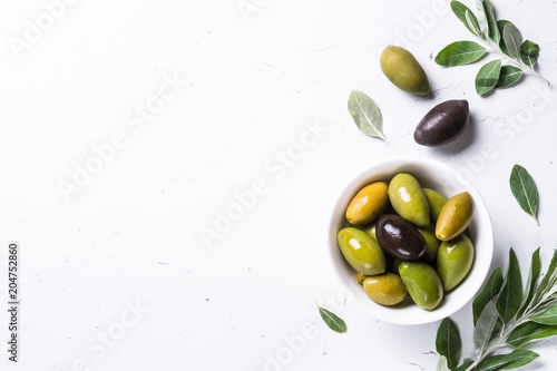 Black and green Olives  on white background.