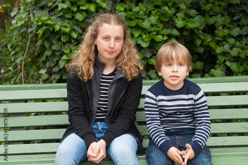 Brothers sitting on a bench