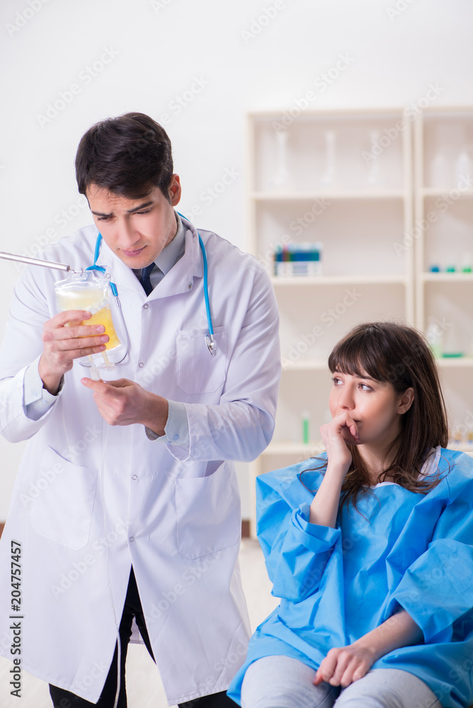 Doctor discussing blood transfusion with patient Doctor discussing blood transfusion with patient