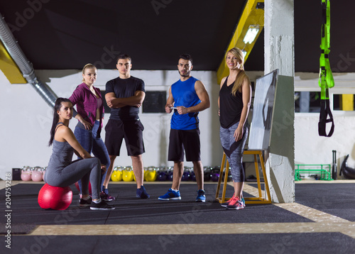 athletes getting instructions from trainer photo