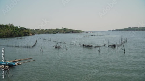 Wallpaper Mural Fish farm with cages for fish and shrimp in the Philippines, Luzon. Fish ponds for bangus, milkfish. Fish cage for tilapia, milkfish farming aquaculture or pisciculture practices. Torontodigital.ca