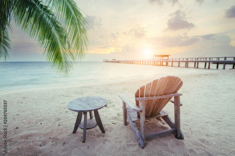 Beautiful beach. Chairs on the sandy beach near the sea. Summer holiday and vacation concept for tourism. Inspirational tropical landscape.at sunset sky