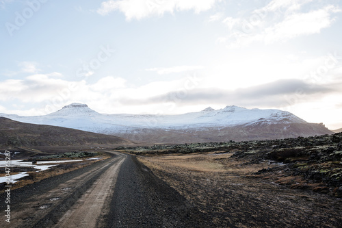 Mountain road leading to the peaks in Iceland.