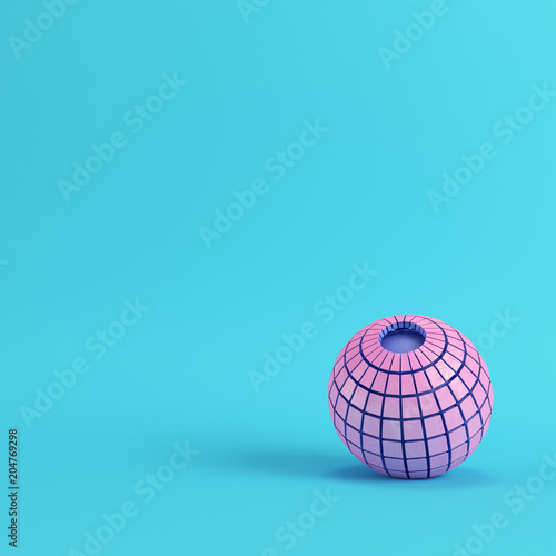 Abstract segmented pink sphere on bright blue background in pastel colors