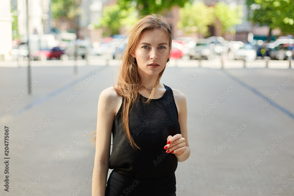 portrait of a business woman on a city background