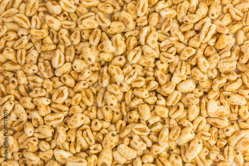 Fotografija background of puffed wheat cereal with honey