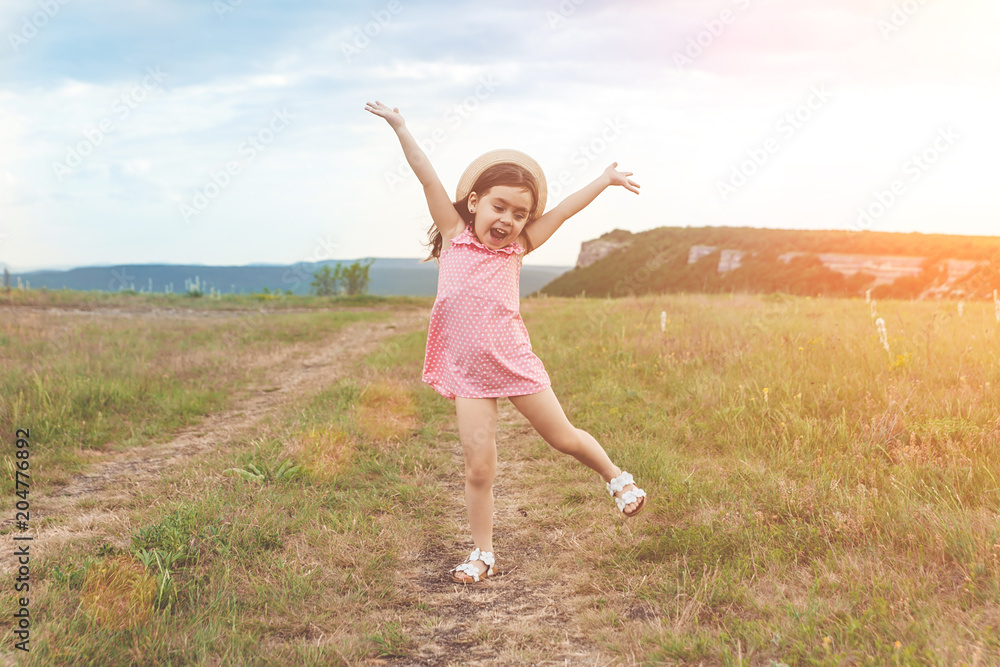 Pretty little girl jumping outdoors Pretty little girl jumping outdoors