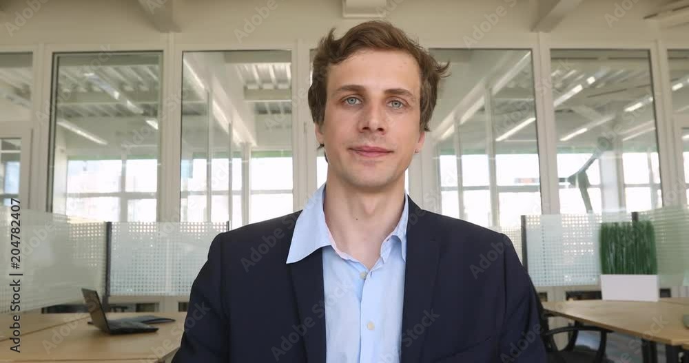 Young caucasian businessman show thumb up in his office Young caucasian businessman show thumb up in his office