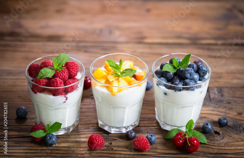 Fresh fruit yogurt with fresh berries and peaches