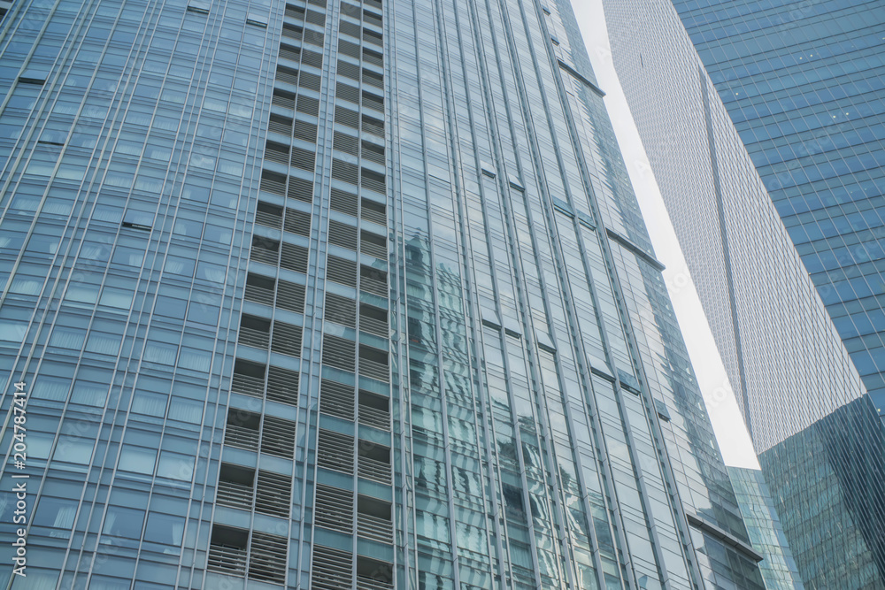 close-up of window walls skyscrapers background