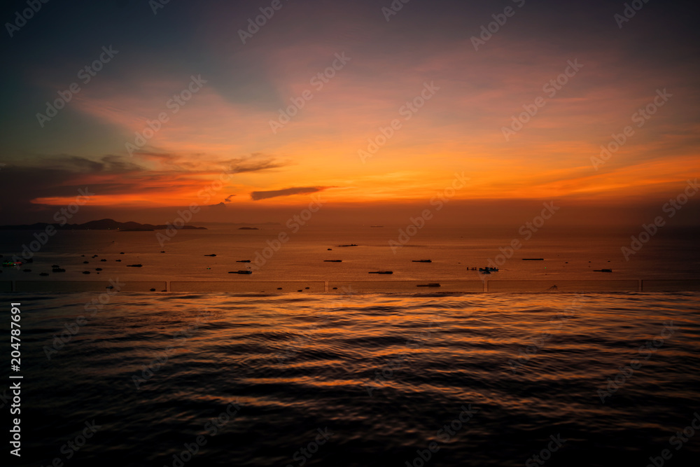 beautiful sunset at the beach and swimming pool