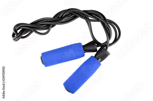 Blue jump rope or skipping rope isolated on white background. Sports, fitness, cardio, martial art and boxing accessories. Top view © Tetiana