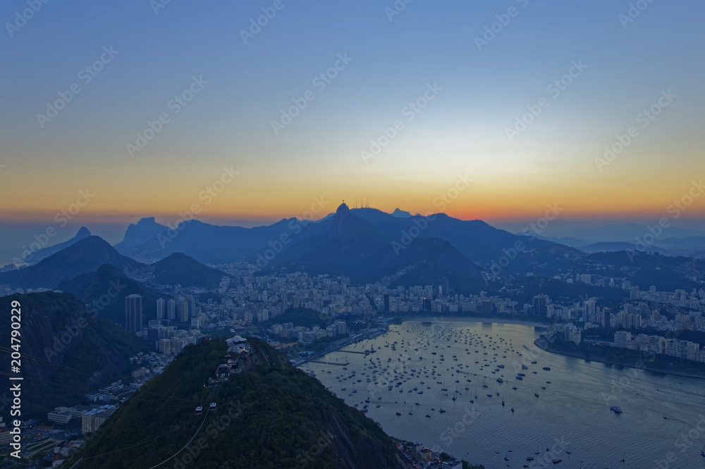 View towards the bay of Rio de Janeiro, from the highest viewpoint ofpão de Açúcar at sunset. Brazil