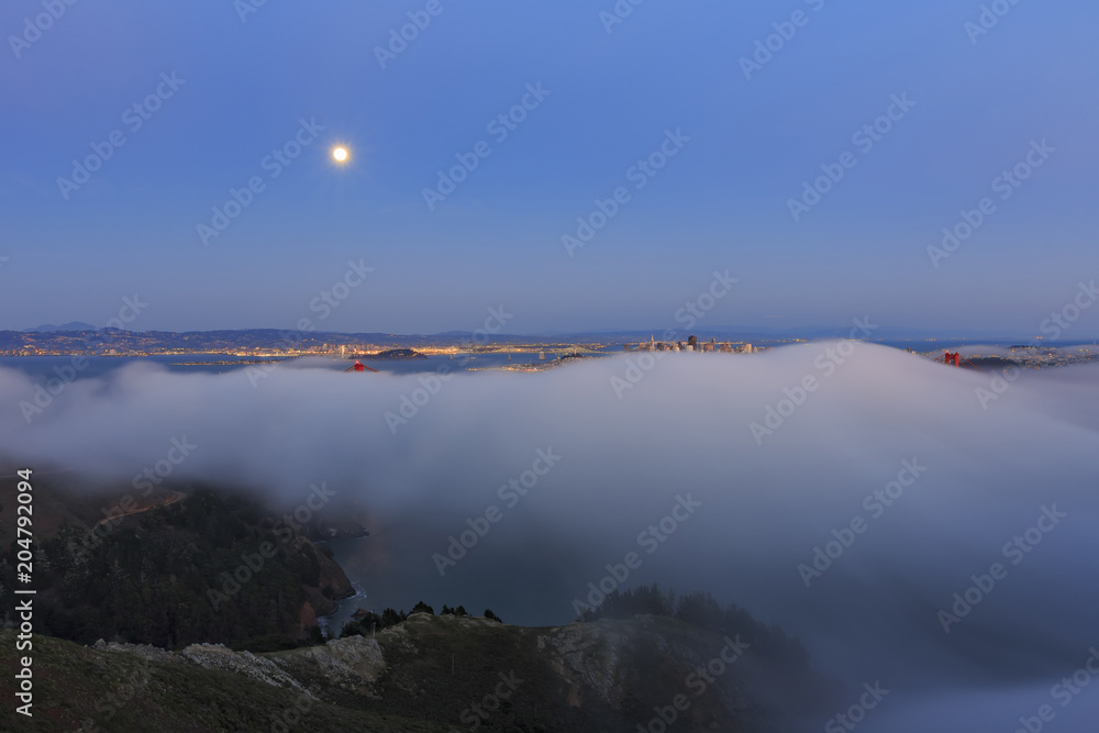 Night moon rise and sea cloud of the famous and beautiful Golden Gate Bridge