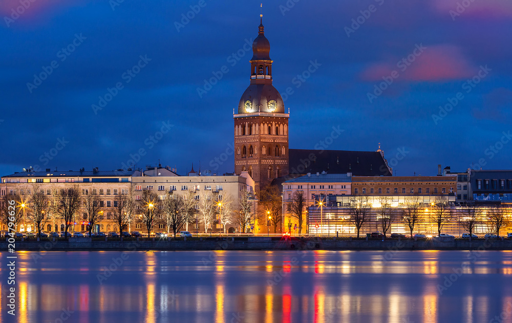 Fototapeta premium Historical building of Riga Dome Cathedral and Daugava river at night , Latvia.