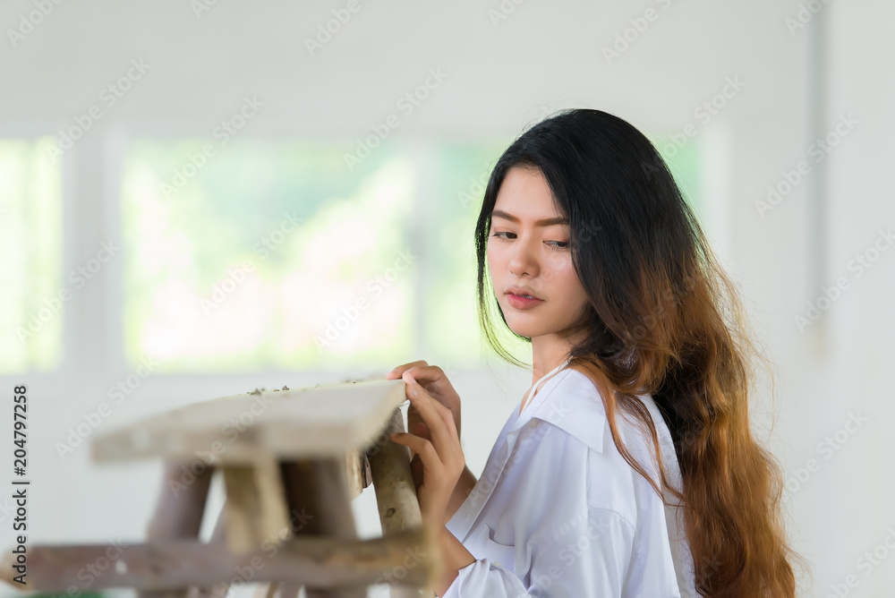 Portrait of beautiful asian woman wear white shirt with a little sexy concept,Thailand people,Lifestyle of modern woman pose for take a picture Portrait of beautiful asian woman wear white shirt with a little sexy concept,Thailand people,Lifestyle of modern woman pose for take a picture