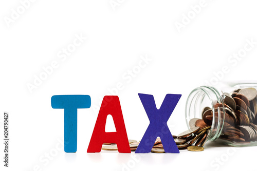 TAX wooden word with pile o...