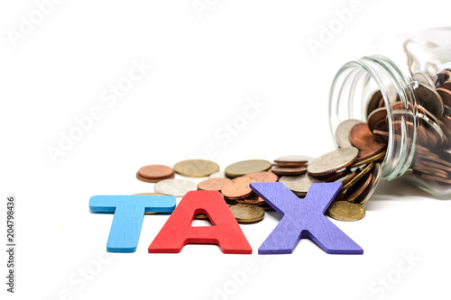 TAX wooden word with pile o...
