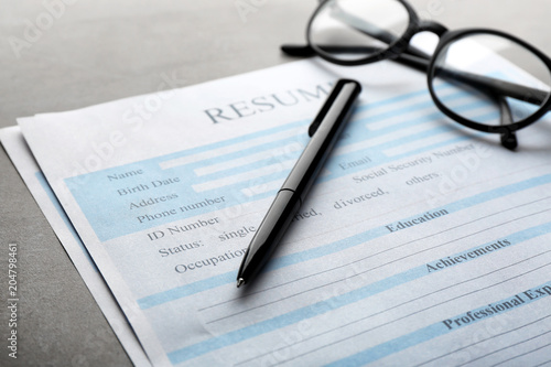 Resume forms and glasses on...